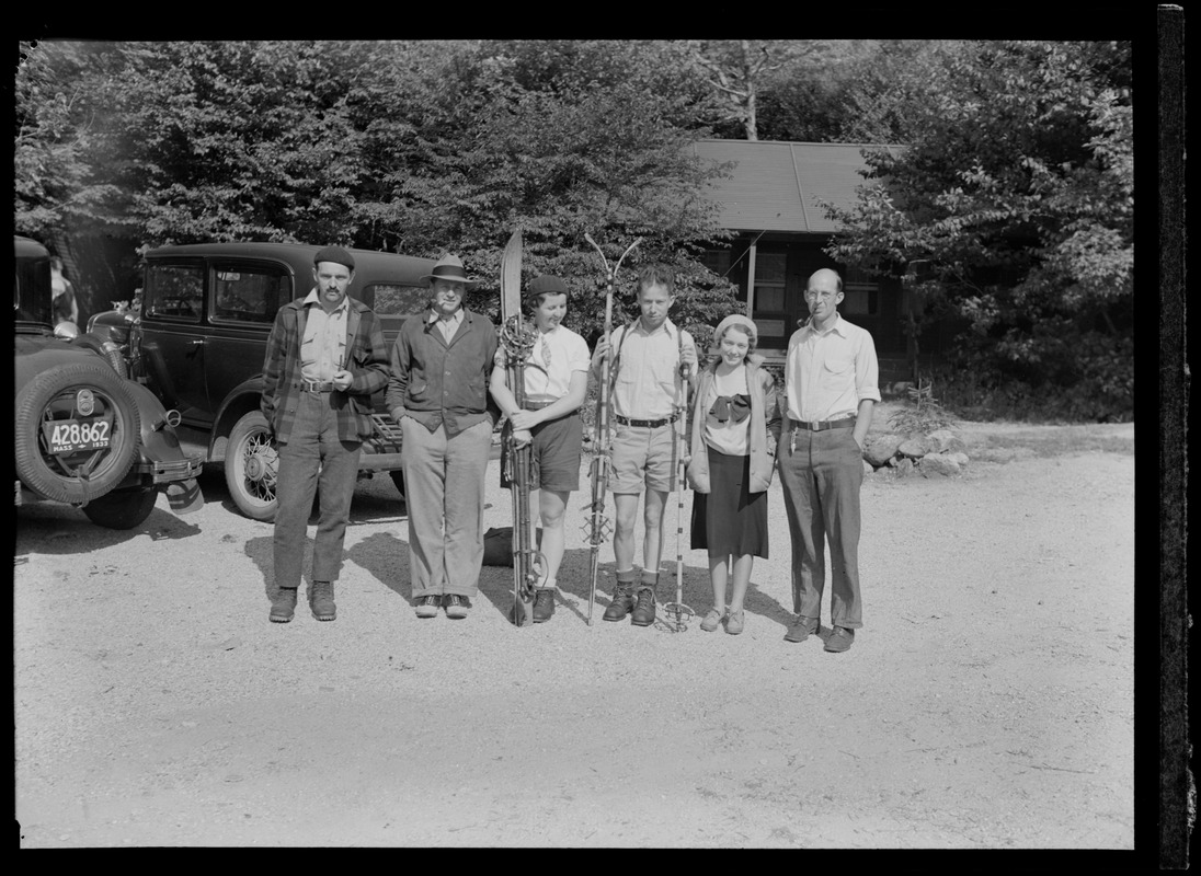 People posing with ski equipment, possibly at Mount Washington