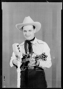 Unidentified man in cowboy outfit with mandolin
