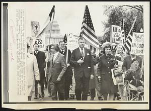 On the March--The "March for Victory" in Vietnam moves along Pennsylvania Avenue today with the Rev. Carl McIntire, center, holding Bible, and Mrs. McIntire at the head of the procession.