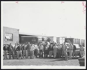 Truck Drivers of the McLean Trucking Co., Somerville, congregate outside company after going on strike. Drivers failed to report to work in the other Greater Boston cities.