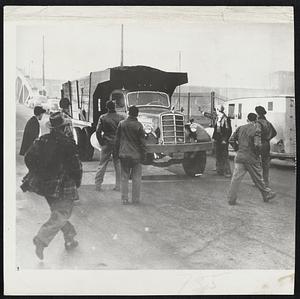 Coal Pickets Stop Truck-Roving mine pickets are shown here near the gates of the Bethlehem Steel Co., in Johnstown, Pa., as they converge on a truck hauling coal from nearby mining operation. The truck was turned back 50 yards from the mill. There was no violence.