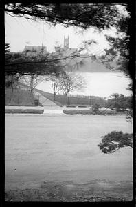 Gasson Hall in background, body of water and street in foreground