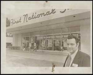 Ralph Denley in front of First National Store