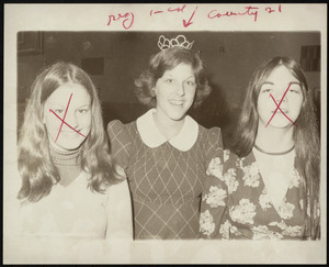 Three unidentified teens, one wearing a tiara