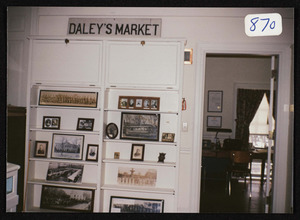 Picture taken at Historical Society Rooms showing pictures and original Daley's Market sign