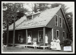 Family in front of cottage, Asbury Grove, circa 1910