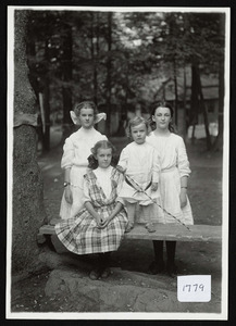 Three girls and one boy posing for a group photo, Asbury Grove, So. Hamilton, Mass