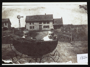 Shows family, twin girls, 1 year old McVey, taken on Bridge St. depicting house, 180 Bridge Street, behind stroller shows Essex branch railroad tracks