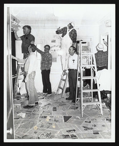 Lions Club members painting community house entry way, 1985