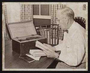 Curator Ha Daley examines William Austin Brown's diaries, circa 1857-1908