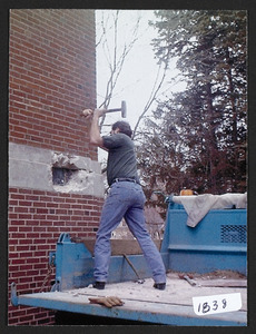 DPW worker breaking wall, exposing time capsule at Hamilton High School, built 1931