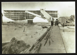 Chales Means ice house on Chebacco Lake, late 1920's, ice harvest being put in house