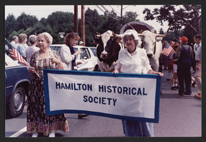 Eleanor McKey and Margarite Brumby carrying historical society banner in the 1987 parade