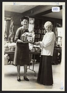 Mrs. Ethyl McCullock receives a basket of goodness from Mrs. Laura Durkee, at Golden Agers thing, 1976