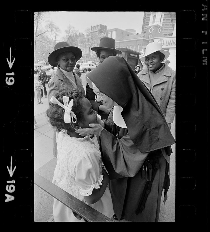 Nun greets black girl on Easter Day, Boston