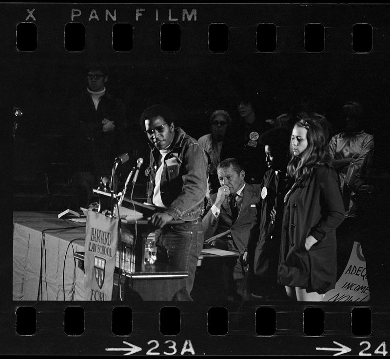 HEW [Health, Education and Welfare] Secretary Robert Finch pre-empted by housing-for-poor demonstrators, Harvard (Sanders Theatre)