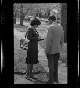 U.S. Census taker interviews man on street, Boston