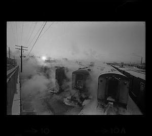 Steam rises from commuter trains in winter, South Boston