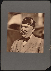 Charles S. Ashley in American Legion cap with logo and Massachusetts beneath