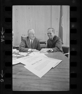 Mayor Collins, left, and Mayor-Elect White discuss city matters during the first meeting between the two at the new City Hall in the Government Center