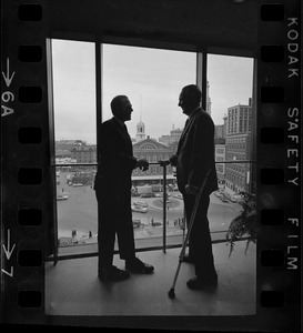 Mayor Collins, left, and Mayor-Elect White discuss city matters during the first meeting between the two at the new City Hall in the Government Center