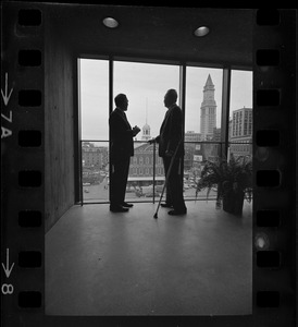 Mayor Collins, left, and Mayor-Elect White discuss city matters during the first meeting between the two at the new City Hall in the Government Center