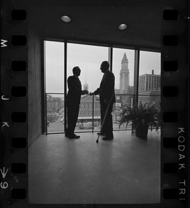 Mayor Collins, left, and Mayor-Elect White discuss city matters during the first meeting between the two at the new City Hall in the Government Center