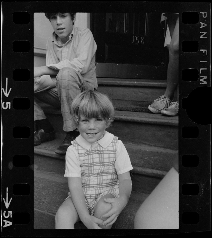 Mark White and Chris White sitting on a stoop