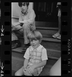Mark White and Chris White sitting on a stoop