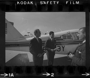 Gubernatorial nominee Kevin White and his running mate Michael Dukakis board plane at Logan Airport for a campaign trip around the Bay State