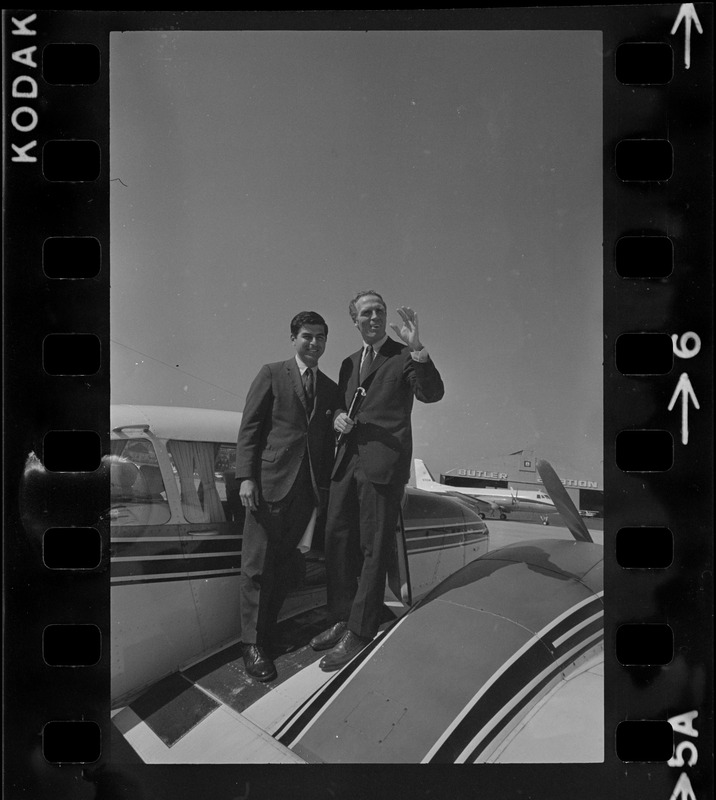 Gubernatorial nominee Kevin White and his running mate Michael Dukakis board plane at Logan Airport for a campaign trip around the Bay State