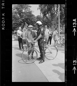 Dr. Paul Dudley White and police officer during 5-mile ride from Boston Common to Jamaica Pond