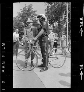 Dr. Paul Dudley White and police officer during 5-mile ride from Boston Common to Jamaica Pond