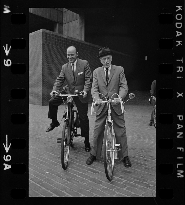 Boston's Park Comr. Joseph Curtis and heart specialist Dr. Paul Dudley White, at City Hall Plaza. They're ready to lead a dozen bicycle enthusiast on a two-mile downtown tour