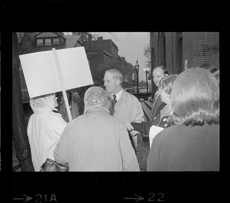 Boston Mayor Kevin White greets poll workers after casting ballots in the Boston mayoralty