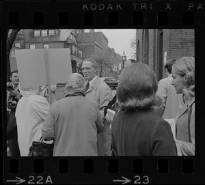 Mayor White and his wife (far right) greet poll workers after casting ballots in the Boston mayoralty