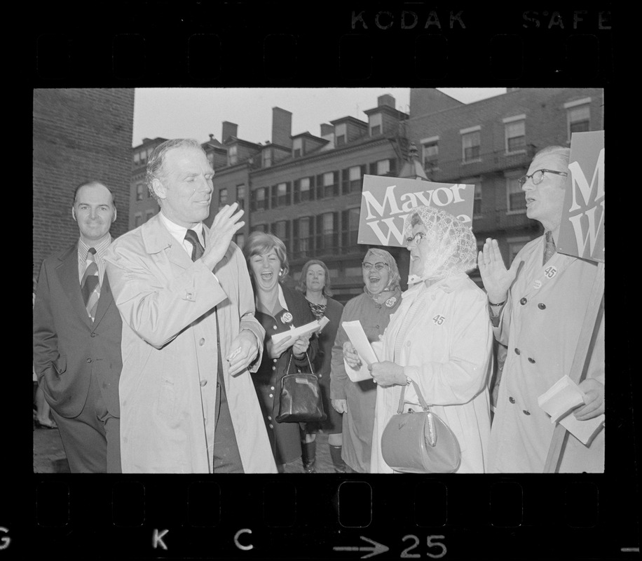 Boston Mayor Kevin White greets poll workers after casting ballots in the Boston mayoralty