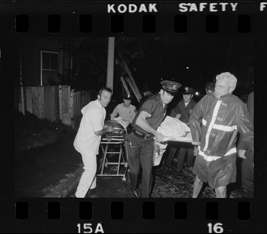 Police And Firefighters Remove Bodies Of Two Victims Of Fire Which 