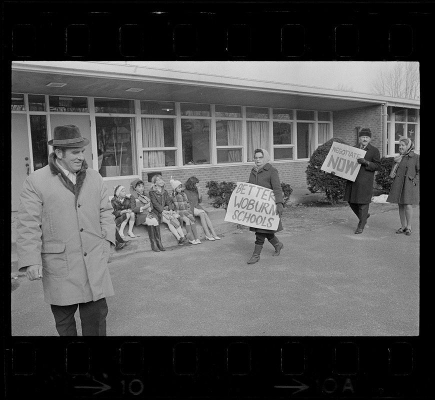 Striking Woburn teachers on picket line at Malcolm S. White Elementary