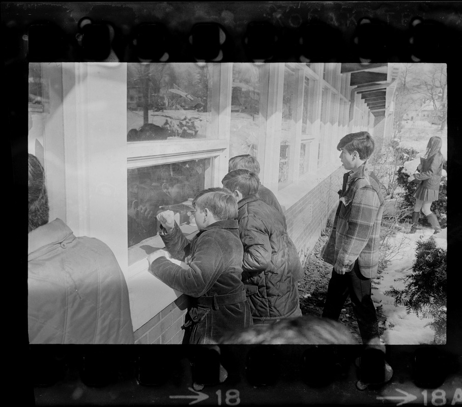 Students looking into windows at Malcolm S. White Elementary School