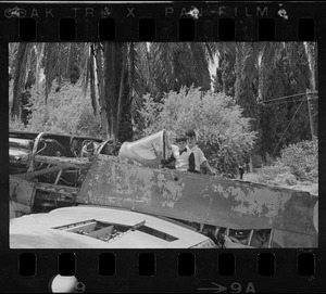 Boys sitting in junked plane, Israel