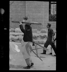 Man balancing tabletop on head, Nazareth, Israel
