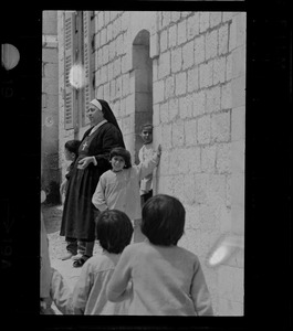 Nun and children, Nazareth, Israel