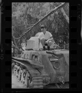 Boy posing on tank, Israel