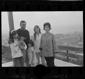 Family posing on patio, Israel