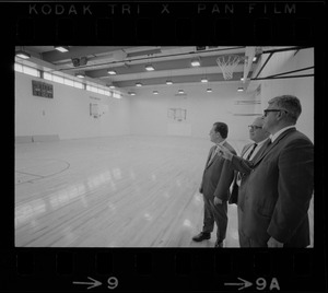 New gym at the West End House Boys' Club is inspected by (from left) executive director Joseph Palladino, past president Charles Merrick, and corporation clerk Michael Cataldo