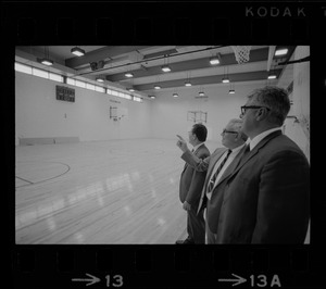 New gym at the West End House Boys' Club is inspected by (from left) executive director Joseph Palladino, past president Charles Merrick, and corporation clerk Michael Cataldo