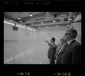 New gym at the West End House Boys' Club is inspected by (from left) executive director Joseph Palladino, past president Charles Merrick, and corporation clerk Michael Cataldo