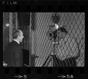 Man, possibly City Councilor Frederick Langone, having his picture taken during a tour of Charles Street Jail