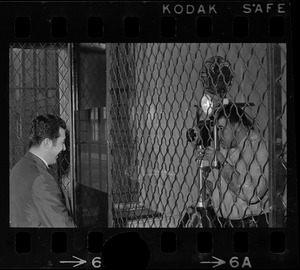 Man having his picture taken during a tour of Charles Street Jail